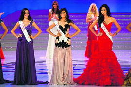 Miss Australia Jessica Kahawaty, Miss India Vanya Mishra and Miss Mexico Mariana Reynoso pose during the Miss World 2012 final ceremony at Dongsheng Stadium in the inner Mongolian city of Ordos.