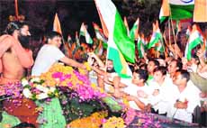 Acharya Balkrishan, accompanied by yoga guru Ramdev, at Chandi Ghat Chowk in Haridwar. 