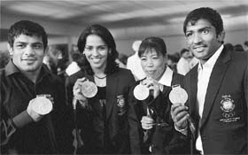 Olympic medal winners Sushil Kumar, Saina Nehwal, MC Mary Kom and Yogeshwar Dutt at the PM House in New Delhi on Friday