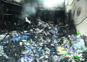 Goods destroyed in a fire that broke out in the industrial estate of Kangra town on Saturday