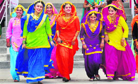 Girls celebrate Teej at the Guru Nanak Khalsa College for Women in Ludhiana on Saturday.