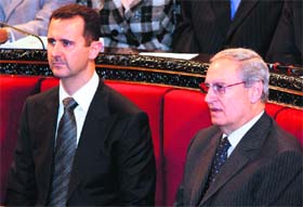 Syrian President Bashar al-Assad (L) with his deputy Faruq al-Shara in Damascus