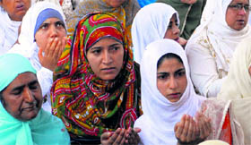Kashmiri Muslim women offer prayers on the eve of Eid on Sunday in Srinagar.
