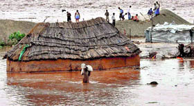 Houses of Gujjar nomads submerged by the overflowing Tawi river in the Jammu region on Sunday.