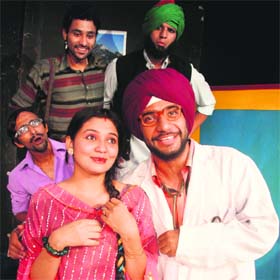 Artistes perform during a play Doctor Palta at Natrang theatre in Jammu on Sunday
