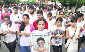 APJ students, staff and parents take out a candlelight march to pay tributes to computer teacher Akansha, in Jalandhar on Sunday. 