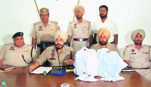 The police with the recovered opium in Khanna.