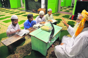The Shahi Imam tells children about the significance of Eid in Ludhiana on Sunday. 