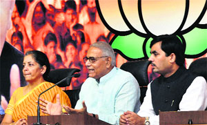 BJP leaders Yashwant Sinha (C), Nirmala Sitaraman and Shahnawaz Hussain in New Delhi on Sunday. 