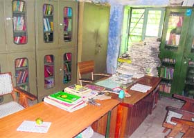 Books lie scattered in the library in the absence of a librarian