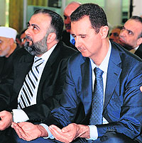 Syrian President Bashar al-Assad attends Eid ul-Fitr prayers in Damascus on Sunday.