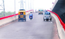 Against rules, commuters come down from a ramp on the elevated road in Amritsar.