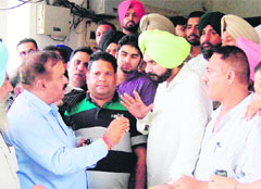 Members of the Property Dealers Association hold a meeting with MP Navjot Singh Sidhu in Amritsar on Monday.