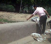 A man dumps garbage in the Sirhind canal in Bathinda unaware of the damage it is causing to the water body. The canal had been cleaned recently at a huge cost.