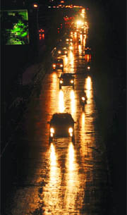 A road after rain at the light point of Phase III-V in Mohali on Monday . 