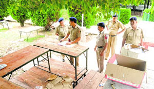 Police officials examine the pool party spot at Lake Club on Monday.