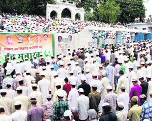 Members of the Muslim community offer prayers at Idgah in Dehradun on Monday .