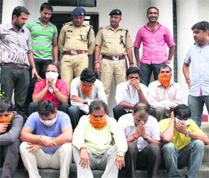 The accused in police custody in Dehradun on Monday. 