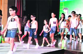 Children walk the ramp during a fashion show organised by a local club in Gurgaon