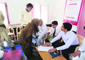 Raj Bala, a Dalit woman, gets appointment as paralegal volunteer, as CJM Harish Gupta looks on at Daulatpur in Fatehabad