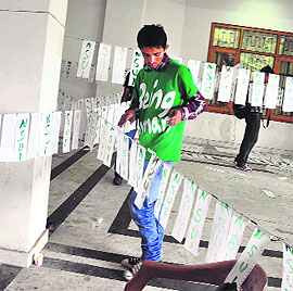 Activists of the NSUI prepare for the forthcoming SCA elections in Shimla on Monday. 