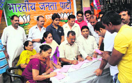 BJP activists organise a membership drive in Jammu on Monday. 