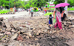 A stone wall that was pulled down by the residents to provide an outlet for rainwater accumulated in Phase IV, Mohali
