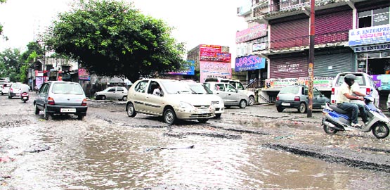 The main Haridwar road in Dehradun in a poor condition. Tribune photo: Vinod Pundir
