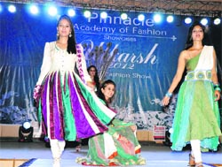 Models display dresses based on the Anarkali theme in a fashion show organised by Pinnacle Academy, Hamirpur. A Tribune photograph