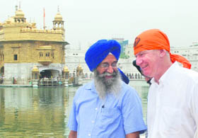 Canadian High Commissioner Stewart Beck (right) pays obeisance at the Golden Temple in Amritsar on Tuesday.