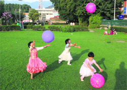 Children play with balloons at Partap Park in Srinagar on Tuesday. Eid-ul-Fitr is time for youngsters to receive Eidyaan from the elderly