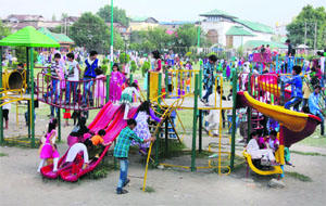 Children throng a children's park on the second day of Eid-ul-Fitr in Srinagar on Tuesday.