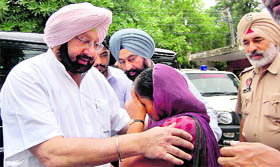 PCC chief Capt Amarinder Singh listens to the grievance of a government employee, who reached out to him after breaching his security cover at the Mohali District and Sessions Courts on Tuesday.