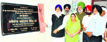 SGPC chief Avtar Singh Makkar (left) inaugurates the hostel block for PG girl students at Shri Guru Ram Dass Institute of Medical Sciences and Research in Amritsar on Wednesday. 