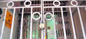 A bank lies closed in Hall Bazaar as bank employees go on strike in Amritsar on Wednesday. 