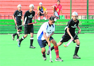 A hockey match in progress during the 11th ONGC SN Vohra Memorial Sub-Junior U-14 Tournament at the Sector 42 stadium in Chandigarh on Wednesday. 