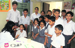 A dentist examines a student at Vatika School in Chandigarh on Wednesday.