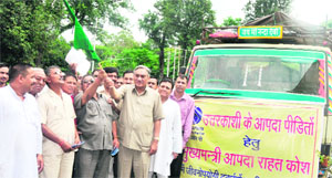 Chief Minister Vijay Bahuguna flags off a truck carrying life-saving medicines for the Uttarkashi cloudburst victims in Dehradun on Wednesday. 