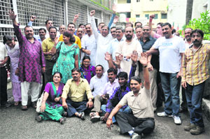 BJP workers hold a demonstration in protest against the move by the government to change the names of schools and universities in front of the District Magistrates office in Dehradun on Wednesday. 