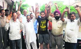 Residents protest against the bad condition of roads in Jalandhar on Wednesday