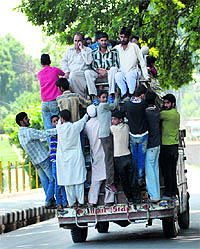 An overloaded vehicle heads towards the tourist resort of Sonamarg in Ganderbal district on Wednesday
