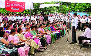Bank employees on strike being addressed by a union leader at Bharat Nagar Chowk in Ludhiana on Wednesday