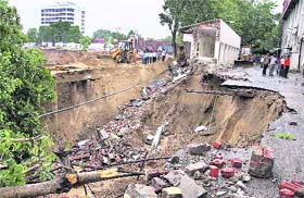 Rain bane in sand land: A portion of the Income Tax Office building that collapsed due to heavy rain in Jaipur