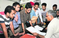 Students submit a joint complaint against Dharmendra Bishnoi at Panjab University on Thursday. Tribune photos: Pradeep Tewari