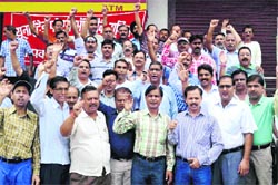 Employees affiliated with the United Forum of Bank Unions protest on the second day of their nationwide strike in Haridwar on Friday. Tribune photo: Rameshwar Gaur