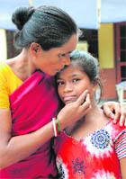 Minor girl Saraswati and her mother after their reunion in Karnal on Thursday. 