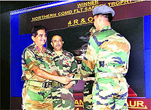 Lt Gen Balbir Pama, Chief of Staff, Northern Command Headquarters, presents the Flight Safety Trophy to Lt Col Anupam Gaur in Udhampur on Thursday
