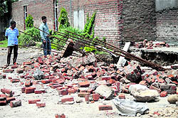 Debris lies scattered after a wall under construction collapsed at Sarore in Samba district on Thursday