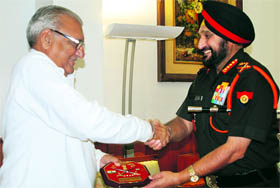 Haryana Chief Minister Bhupinder Singh Hooda being presented a memento by Army Chief Gen Bikram Singh in Chandigarh on Thursday.