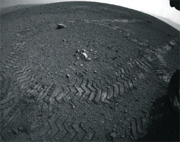 Tracks left by the Curiosity rover on Mars. 